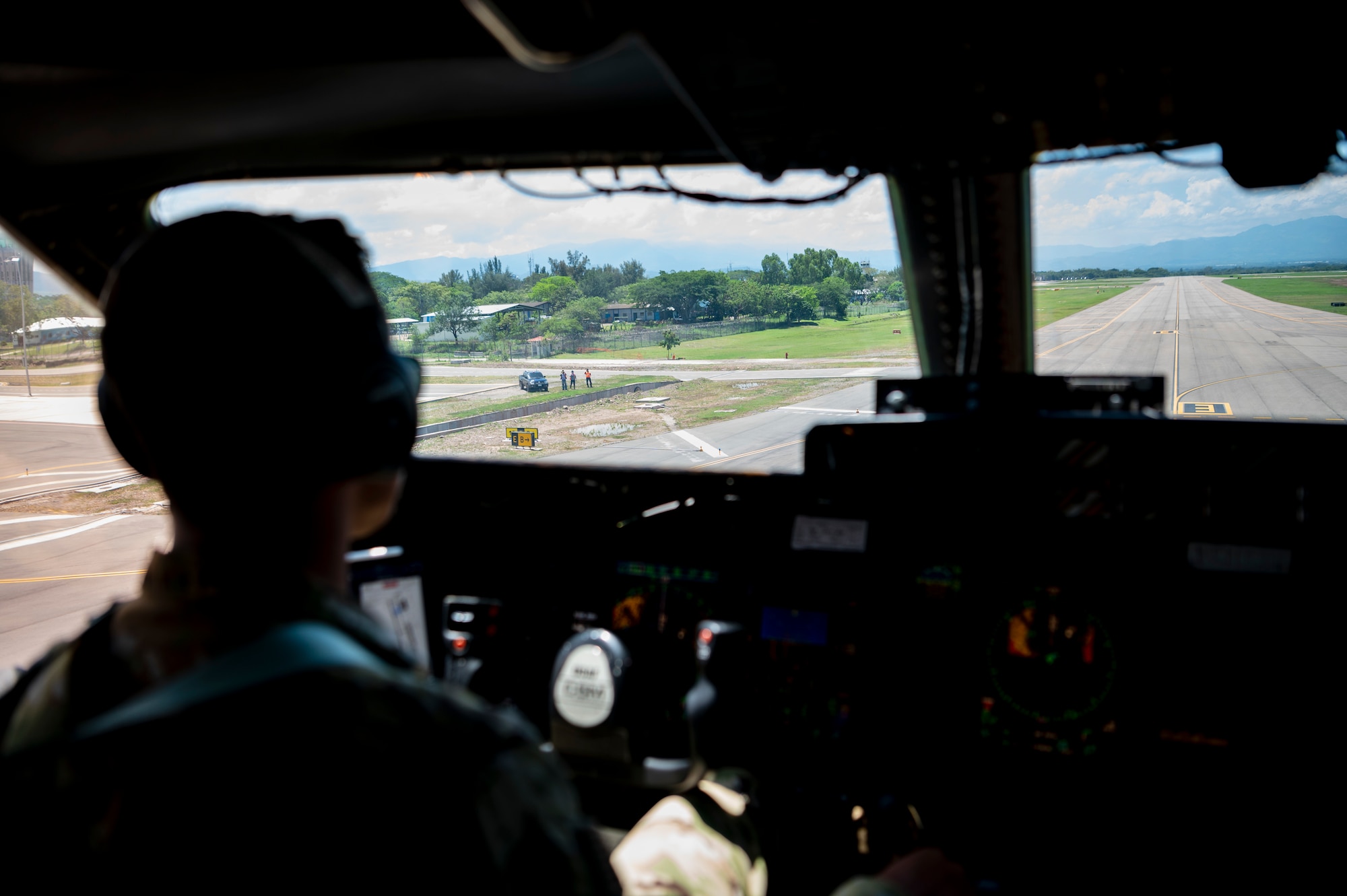 A pilot flies an airplane.