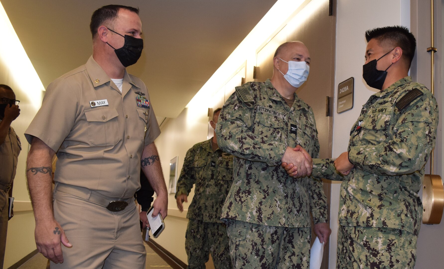 Hospital Corpsman 1st Class Sonnypaul Soriano doesn't often get rendered speechless, but that's what happened when he receiving the news on being selected for U.S. Navy chief petty officer from Capt. Patrick Fitzpatrick, Naval Hospital Bremerton director and NMRTC Bremerton commanding officer and Command Master Chief James B. May (official Navy photo by Douglas H Stutz, NHB/NMRTC Bremerton public affairs officer).