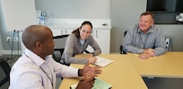 Student mediators, Gary Ratcliffe, Master Sgt. Lesli Pape and Donald Satterlee, role play during a mock mediation scenario of the Advanced Mediation course held in Washington, D.C., Aug. 31, 2022. The Department of the Air Force partnered with the Federal Mediation and Conciliation Service to bring about this training. (Courtesy photo by Kimberly Mlinaz)