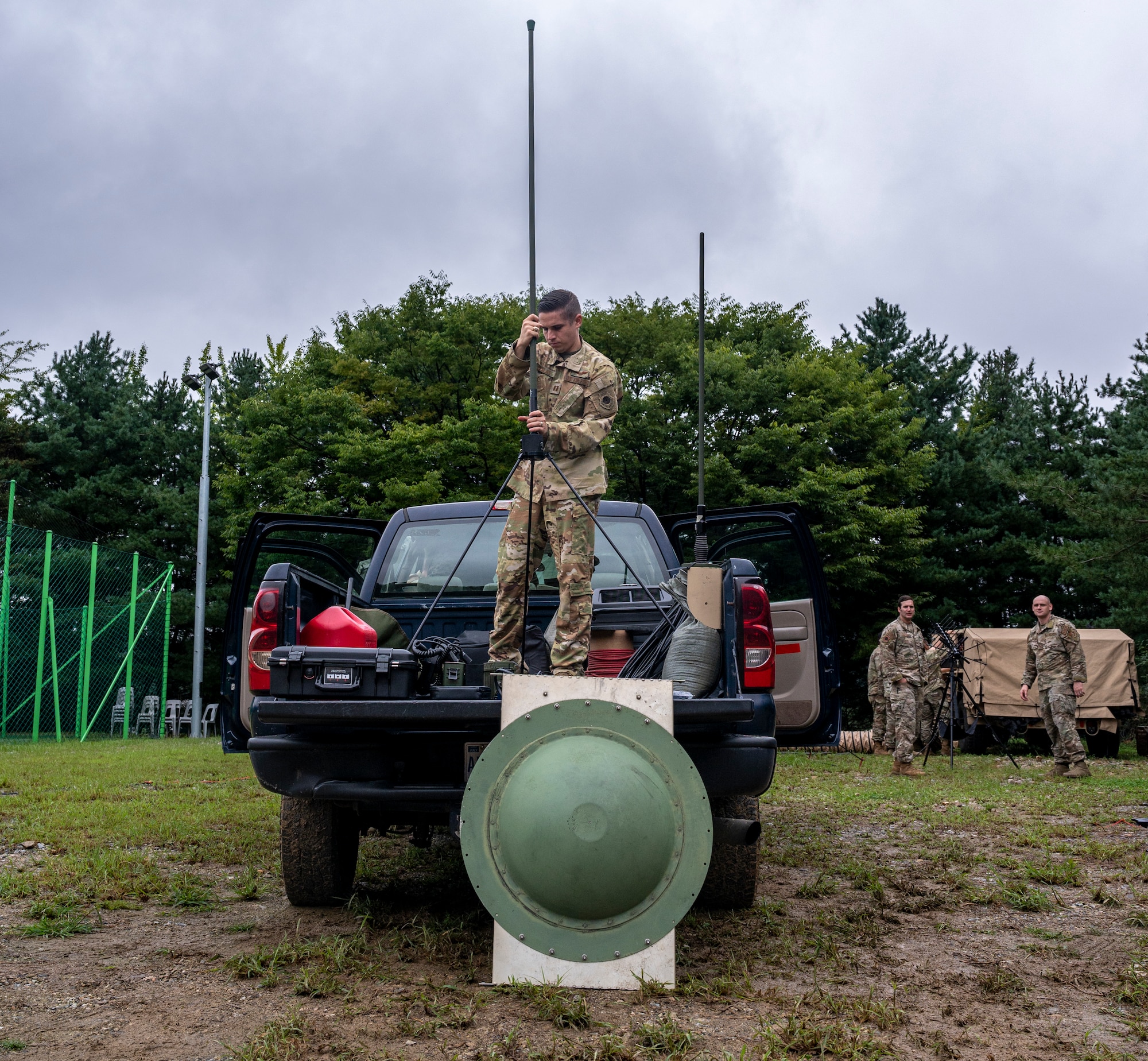 Capt. Cory Yslas, 621st Air Control Squadron chief of weapons and tactics connects an ultra high frequency antenna in the bed of a mobile tactical command and control (C2) vehicle at Yongin Army Base, Republic of Korea, Aug. 31, 2022.