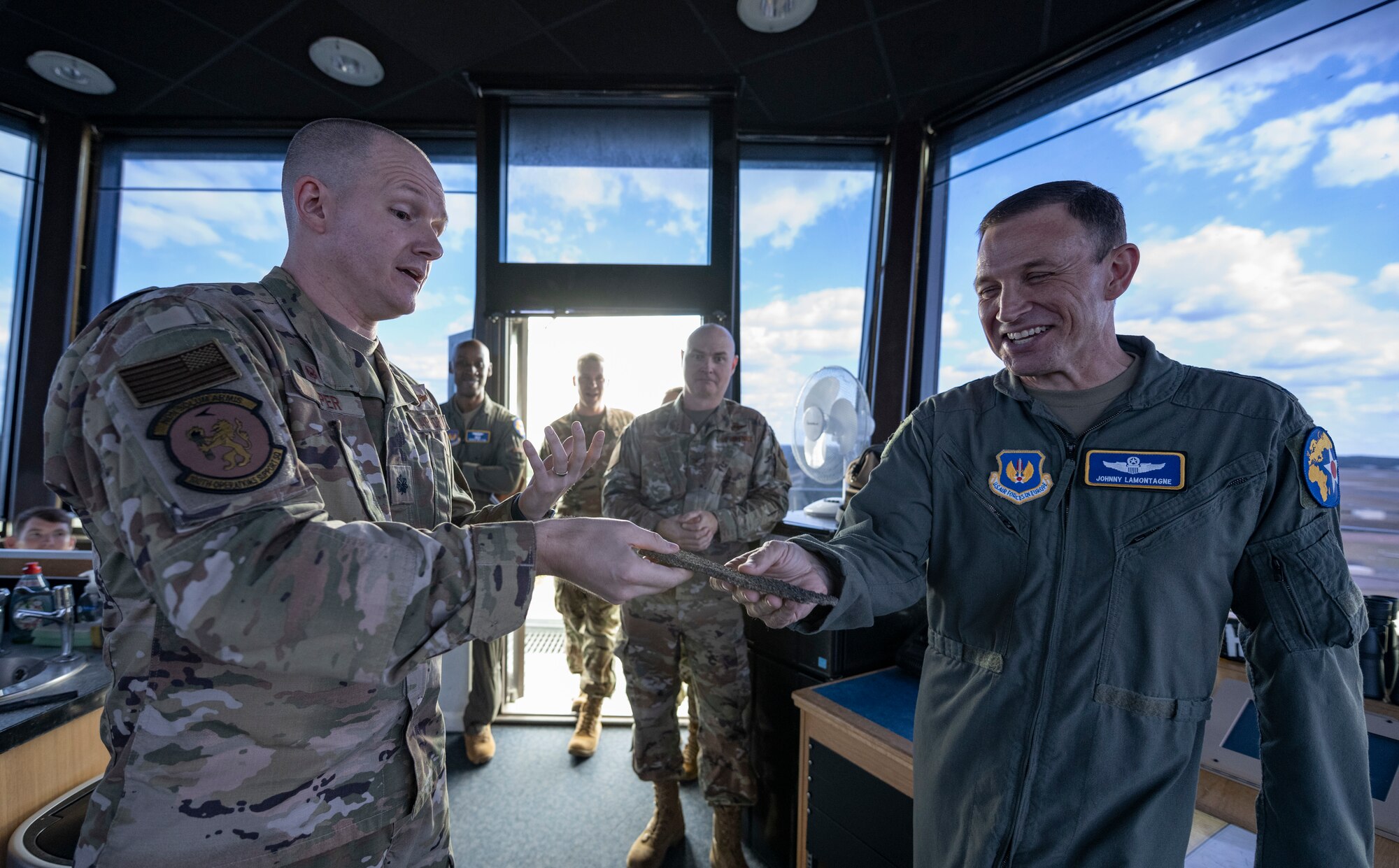 U.S. Air Force Lt. Col. Daniel Piper shows flightline ground material to Lt. Gen. John D. Lamontagne