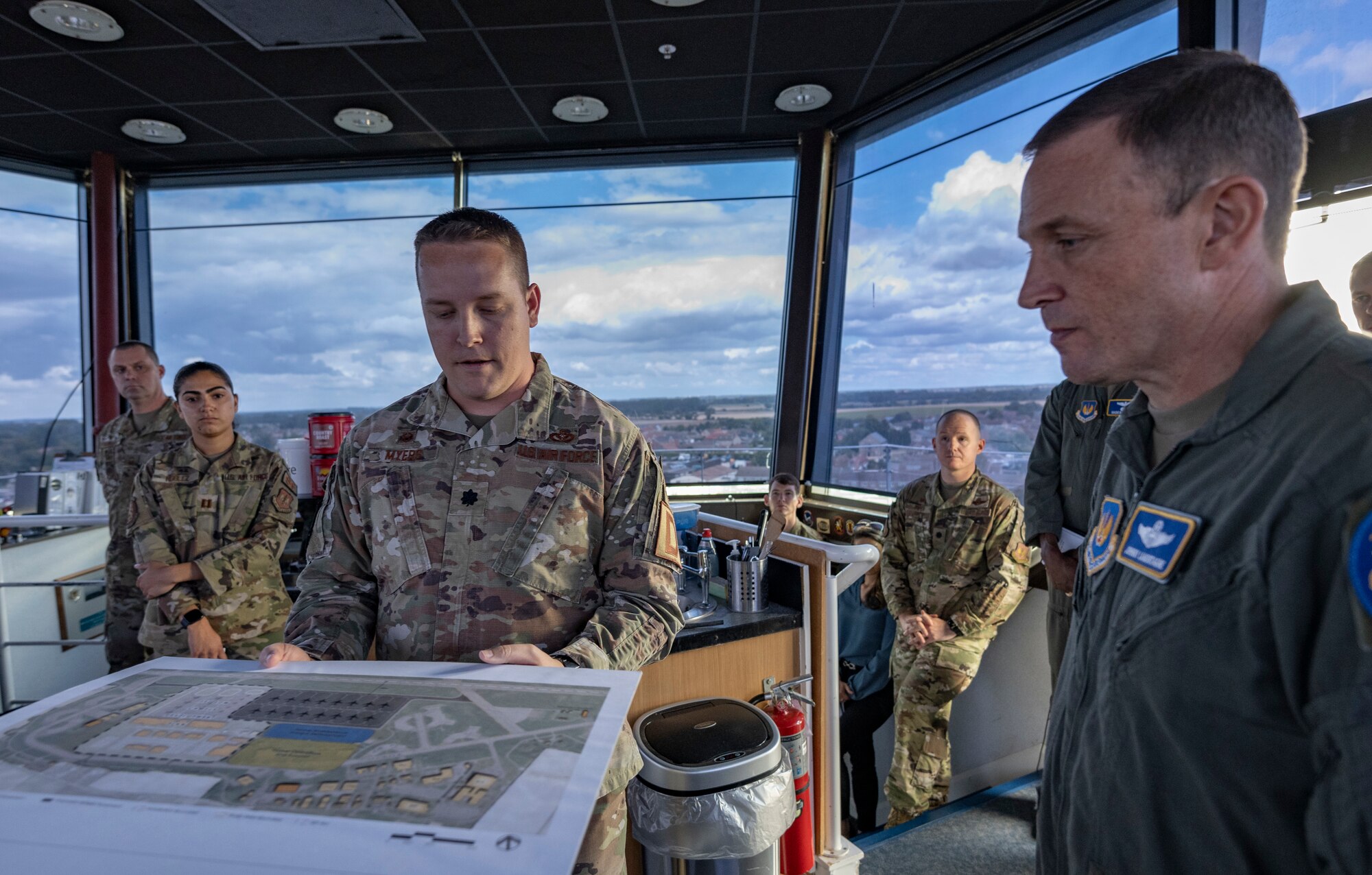 U.S. Air Force Lt. Col. Andrew Myers demonstrates flightline maintenance plans to Lt. Gen. John D. Lamontagne