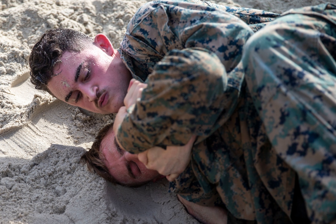 U.S. Marine Corps Cpl. Joshua McCurry, an intelligence specialist with 2d Battalion, 2d Marine Regiment, 2d Marine Division, participates in a ground fighting event during the Warlord Games on Camp Lejeune, North Carolina, Sept. 1, 2022. The Warlord Games is a quarterly event where Marines from 2/2 compete in various competitions to strengthen the unit's esprit de corps. (U.S. Marine Corps photo by Cpl. Karlhendrix Aliten)