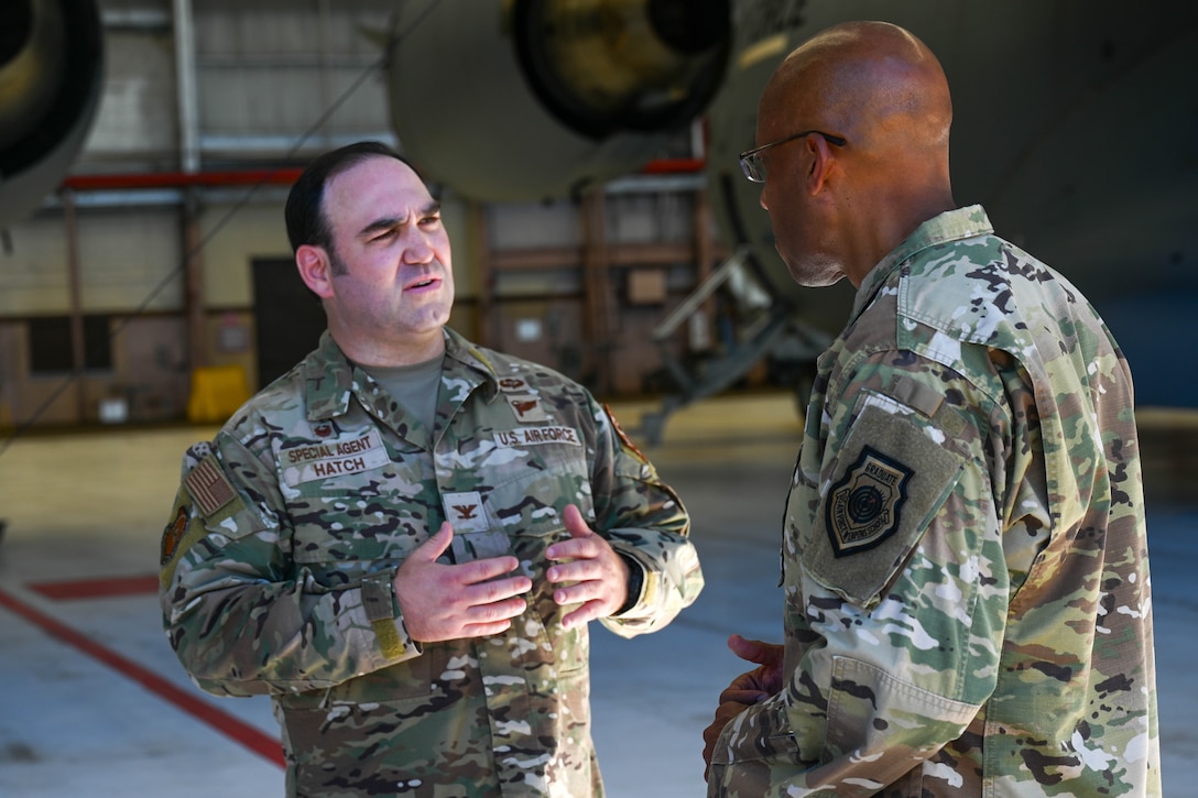 Chief of Staff of the Air Force, Gen. Charles Q. Brown, chats with OSI Field Investigations Region 6 Commander and Special Agent In Charge, Col. Benjamin Hatch, during the CSAF's visit to Joint Base Pearl Harbor-Hickam, Hawaii, Aug. 5, 2022. (U.S. Air Force photo by SrA Makensie Cooper, 15 AW/PA)