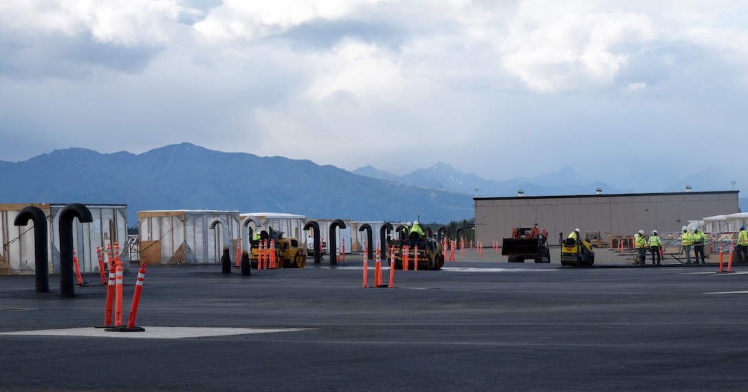 Construction crews smooth newly poured pavement at missile field 4 at Fort Greely, Alaska, on August 17. Once completed, the missile field will house 20 anti-ballistic missile interceptor missiles. (Photo by Kristen Bergeson)