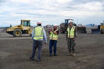 Jason Wilson, program manager for the U.S. Army Corps of Engineers Alaska District, leads Bret Styers, senior program manager for the Ballistic Missile Defense Mandatory Center of Expertise at the U.S. Army Engineering and Support Center, Huntsville, and Col. Sebastien P. Joly, Huntsville Center commander, on a tour of the missile fields at Fort Greely, Alaska, in August. (Photo by Kristen Bergeson)