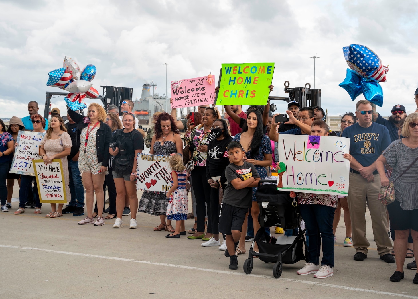 NORFOLK (Sept. 9, 2022) Family members await the arrivial of their Sailors as the USS San Jacinto (CG-56) returns to Naval Station Norfolk after a regularly scheduled deployment in the U.S. 5th Fleet and U.S. 6th Fleet areas of operations, Sept. 8. San Jacinto was deployed as part of the Harry S. Truman Carrier Strike Group in support of theater security cooperation efforts and to defend U.S., allied and partner interests. (U.S. Navy photo by Mass Communication Specialist 1st Class Ryan Seelbach)