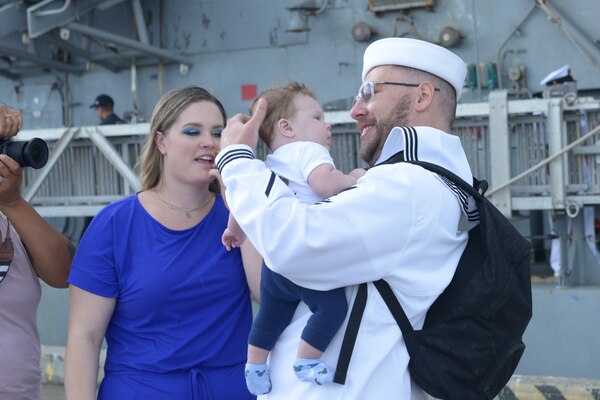 NORFOLK (Sept. 8, 2022) Sailors aboard the USS San Jacinto (CG-56) greet their families at Naval Station Norfolk after a regularly scheduled deployment in the U.S. 5th Fleet and U.S. 6th Fleet areas of operations, Sept. 8. San Jacinto was deployed as part of the Harry S. Truman Carrier Strike Group in support of theater security cooperation efforts and to defend U.S, allied and partner interests. (U.S. Navy photo by Mass Communication Specialist 2nd Class Julia Johnson)