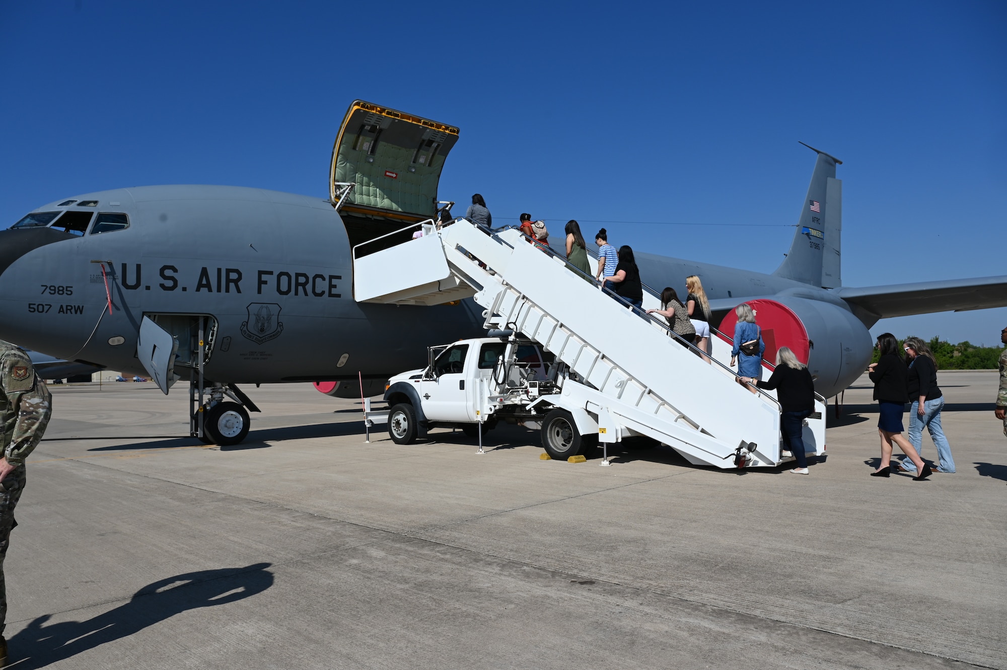 people boarding a plane