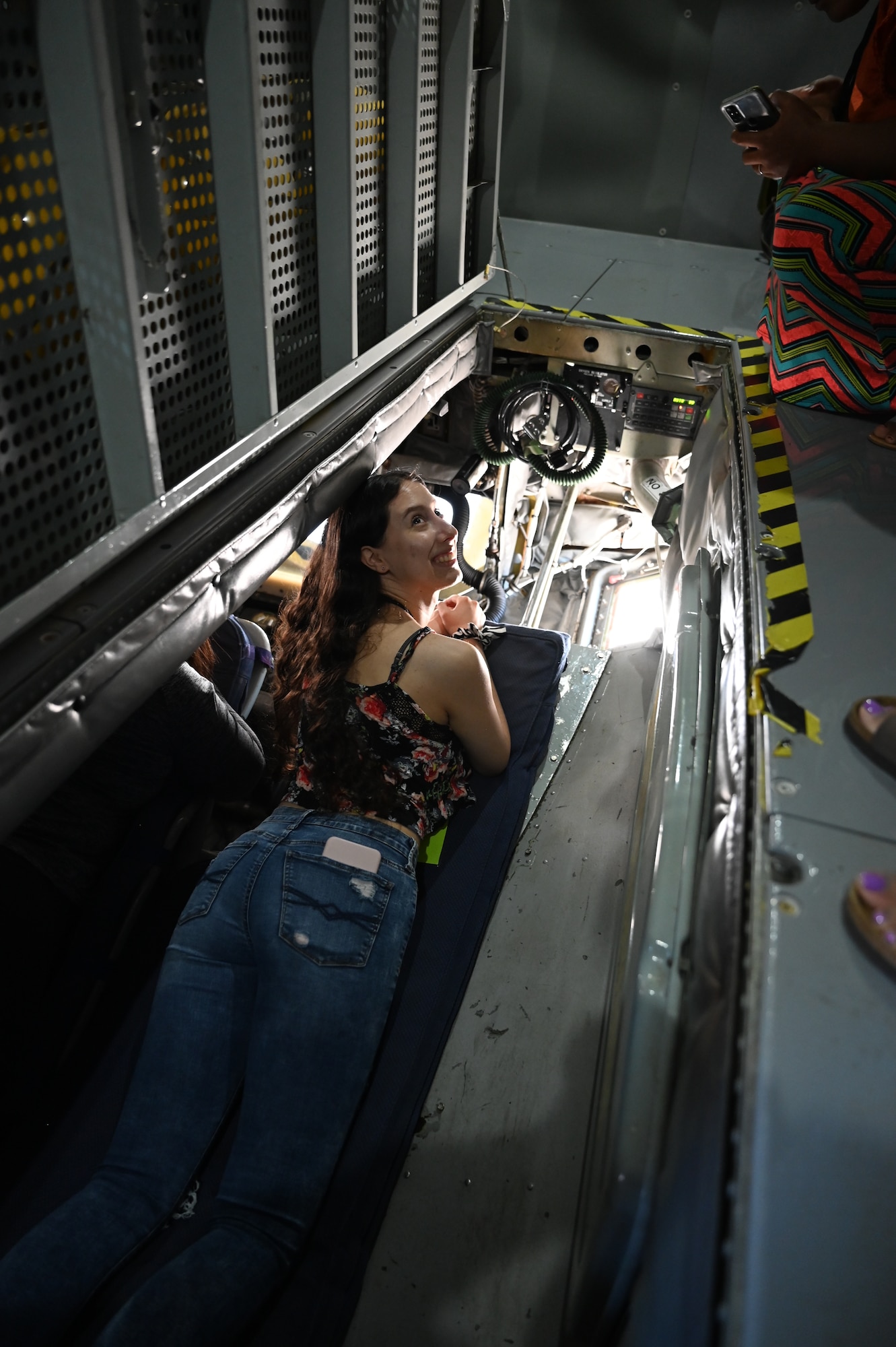 person laying in the boom pod