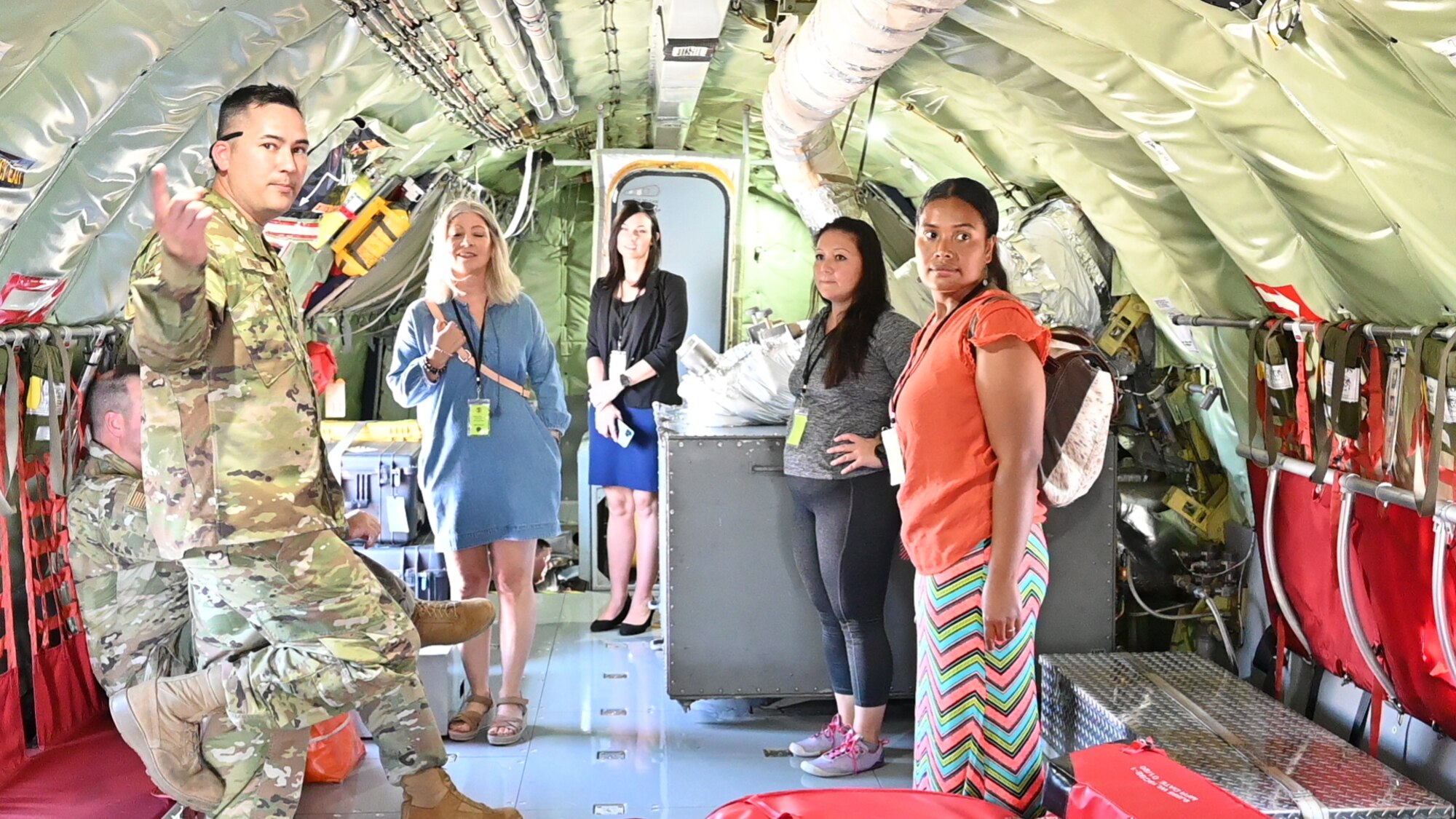 people standing inside a plane