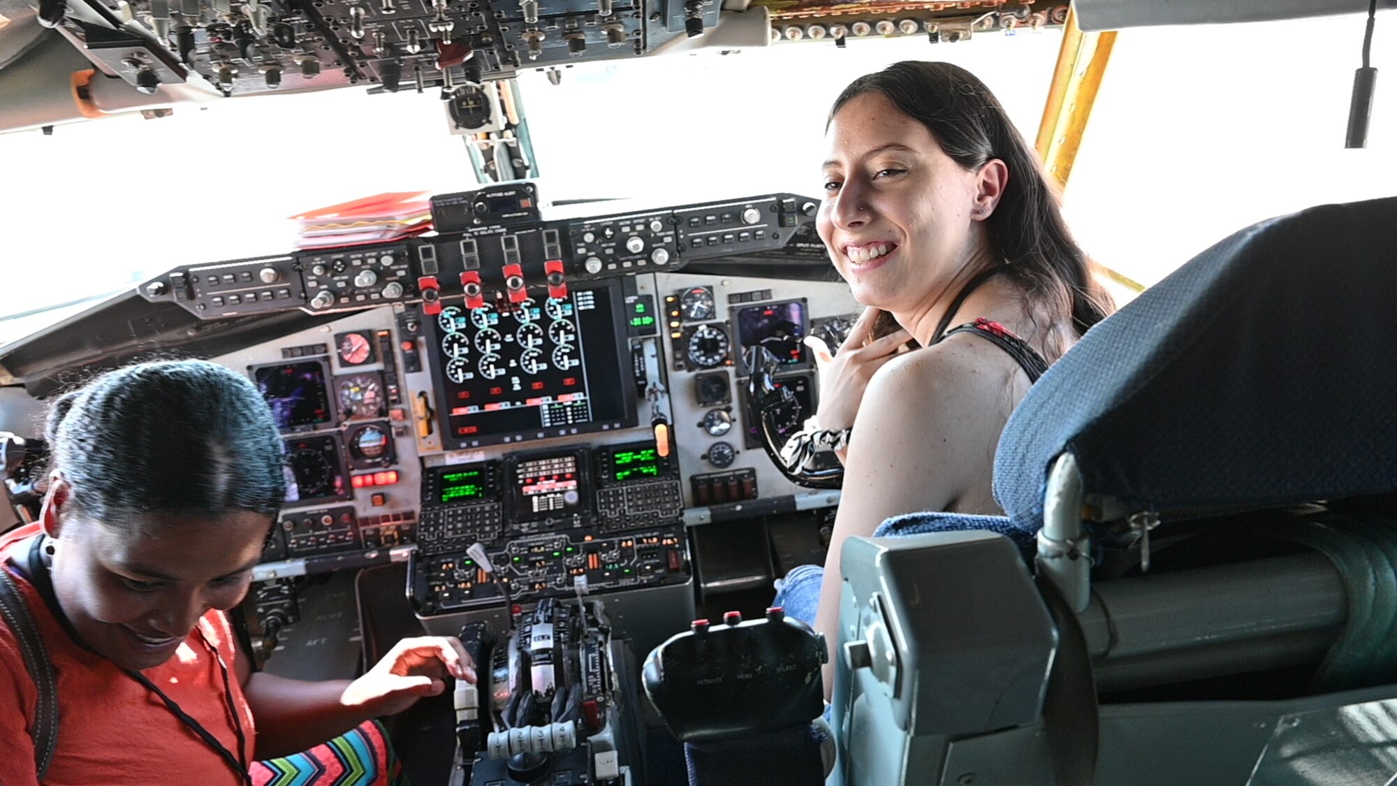 people sit in the plane cockpit