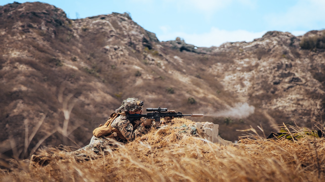 A U.S. Marine with 3rd Littoral Combat Team, 3rd Marine Littoral Regiment, 3rd Marine Division, fires down range during a live-fire range for Bougainville I at Marine Corps Base Hawaii, Aug. 31, 2022. Bougainville I allows fire teams and squads with 3rd LCT to rehearse small unit cohesion, lethality, and survivability for company offensive, defensive, and Expeditionary Advanced Base Operations during future exercises.