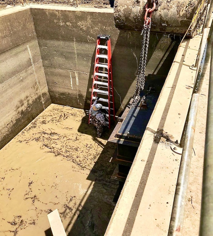 The Memphis District's Revetment Branch and Metals Units recently finalized a flapgate repair on what’s called the “Fritz Landing Culvert” in Lake County, Tennessee, in August 2022. 

“In 2021, the flapgate on the river side end of one of the culverts became loose, fractured, and fell off,” Project Manager Mark Mazzone said. “The flapgates ensure that flood water cannot back up through the culverts. They also provide the actual protection against flooding through culvert openings in the levee.”  

To repair the flapgates, construction involved building temporary cofferdams, pumping standing water to access the end of the culvert, fabrication and installation of temporary structures, and fabrication/installation of a replacement collar and supporting structure. (Courtesy photo)