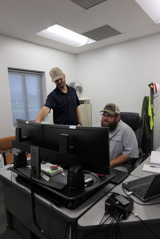 Members of the Irvington site team work together to complete their mission at their office on August 25, 2022, in Irvington, AL. The Irvington team consist of dredging support sections, navigation support section, survey unity, geospatial unit, and floating unit.  (U.S. Army photo by Jeremy Murray)