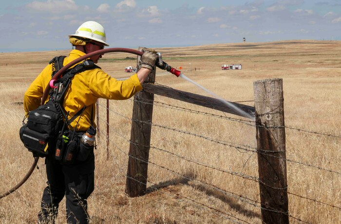 Crew members of the Air Force Civil Engineer Center Wildland Fire Support Module conduct a prescribed fire, also known as a controlled burn, on June 6th, 2022 at Beale Air Force Base, Calif.