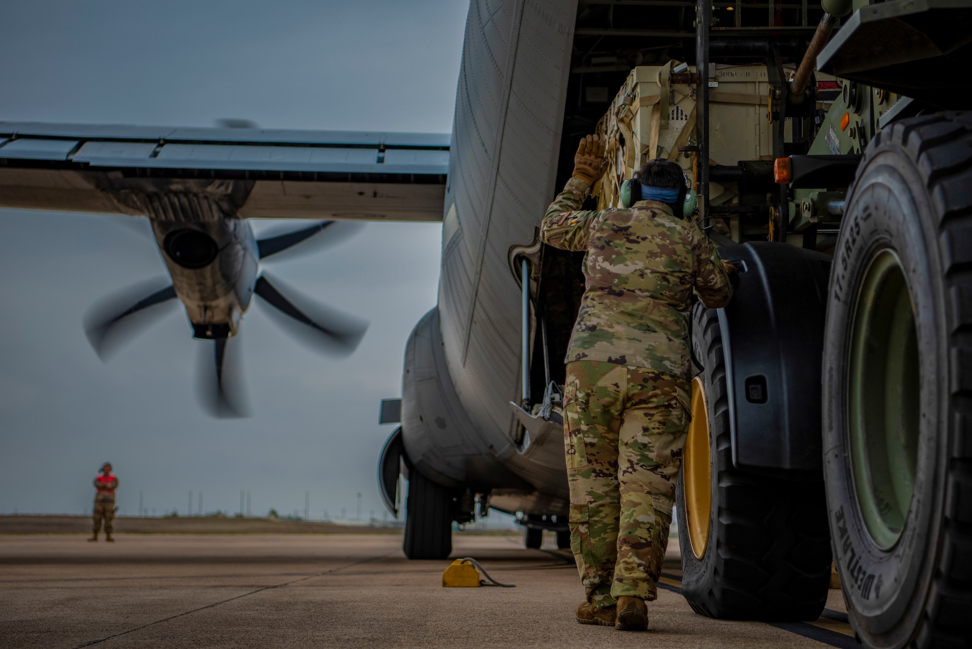 Tech. Sgt. Dani Galich, 40th Airlift Squadron tactics flight chief, loads the back of a C-130J Super Hercules during exercise Patriot Fury at Robert Gray Army Airfield, Fort Hood, Texas, Aug. 30, 2022. Patriot Fury ensured the production of more experienced aircrews while proactively increasing the survivability of personnel and Air Force assets while generating tactical airlift power and deterrence. (U.S. Air Force photo by Airman 1st Class Ryan Hayman)