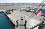 U.S. Marines with Combat Logistics Regiment 1, 1st Marine Logistics Group, drive a tactical vehicle onto the USNS Seay during exercise Native Fury 22 at Yanbu Commercial Port, Kingdom of Saudi Arabia, Aug. 26, 2022. The Kingdom of Saudi Arabia enables the U.S. Marine Corps Central Command and U.S. Central Command to receive and employ forces and resources rapidly in the region through a growing network of western geographic access and staging points.