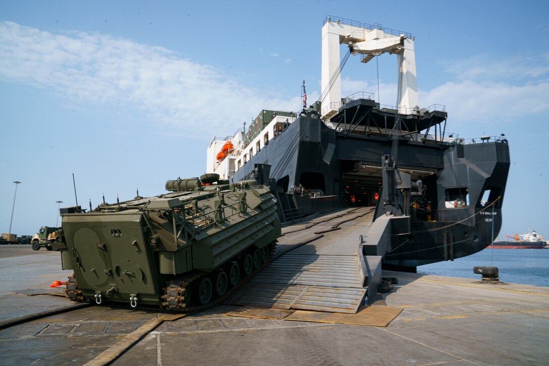 U.S. Marines assigned to Combat Logistics Regiment 1, 1st Marine Logistics Group, load an A1 Assault Amphibious Vehicle onto the USNS Seay during exercise Native Fury 22 at the Yanbu Commercial Port, Kingdom of Saudi Arabia, Aug. 29, 2022. The focus of Native Fury 22 is to execute a Maritime Prepositioning Force in the U.S. Central Command area of responsibility in support of regional security, crisis response, and contingency operations.