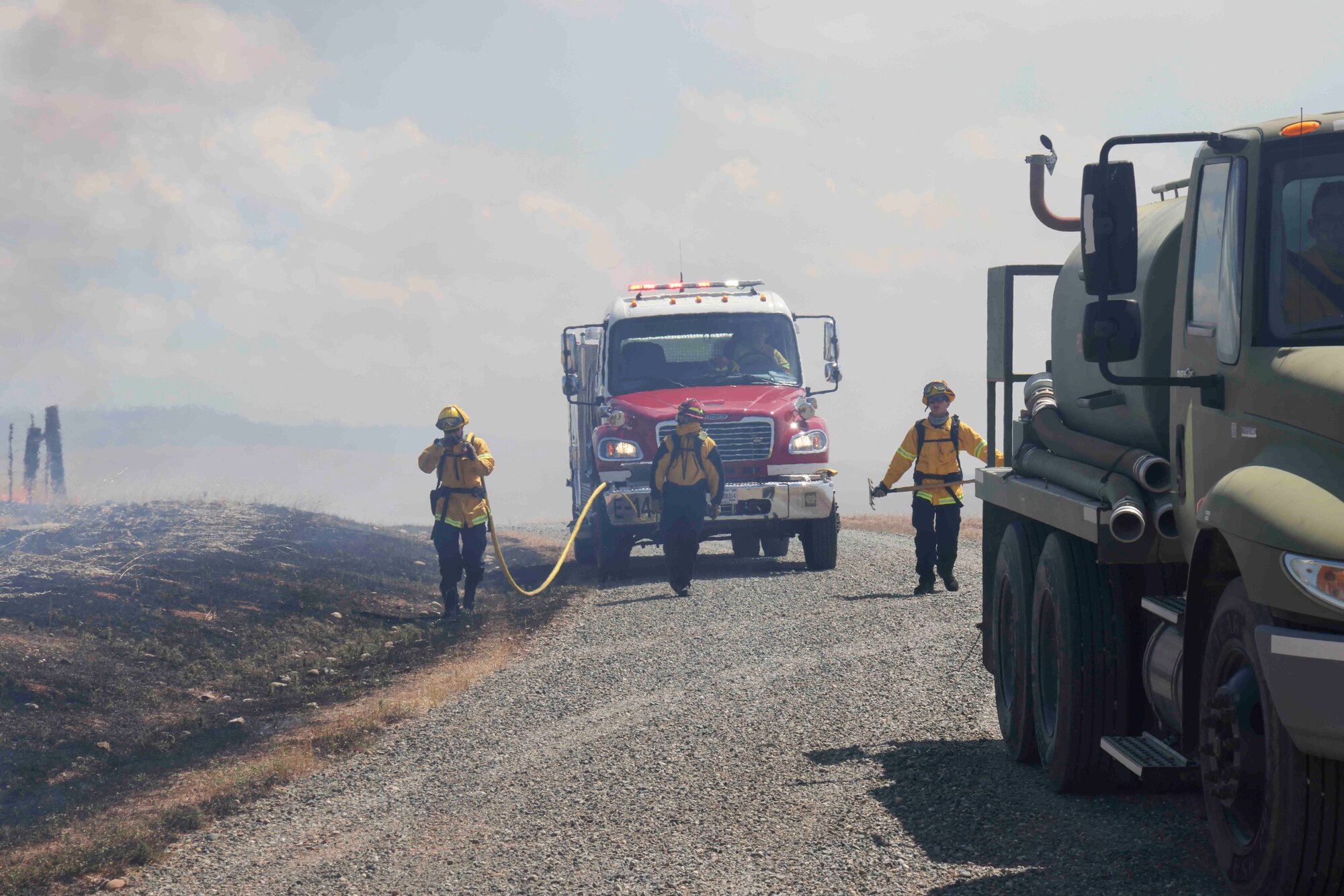 Crew members of the Air Force Civil Engineer Center Wildland Fire Support Module conduct a prescribed fire, also known as a controlled burn, on June 6th, 2022 at Beale Air Force Base, Calif.