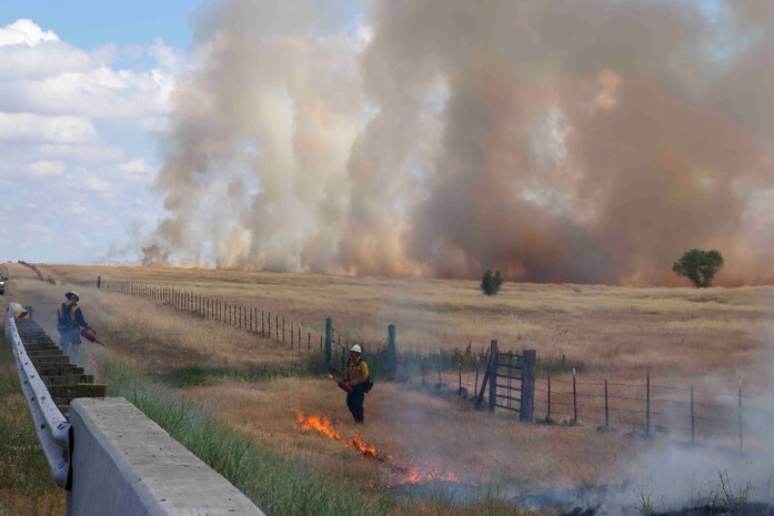 Crew members of the Air Force Civil Engineer Center Wildland Fire Support Module conduct a prescribed fire, also known as a controlled burn, on June 6th, 2022 at Beale Air Force Base, Calif.