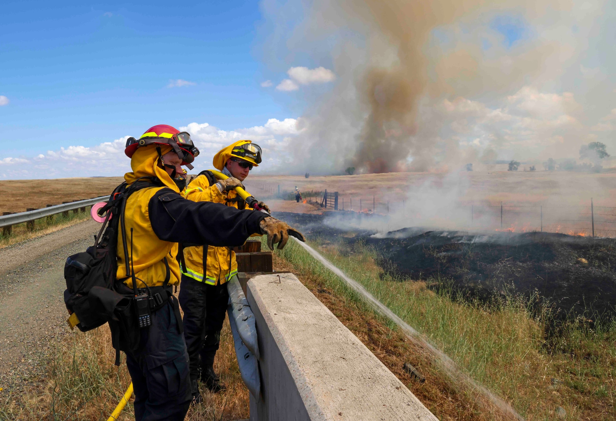 Crew members of the Air Force Civil Engineer Center Wildland Fire Support Module conduct a prescribed fire, also known as a controlled burn, on June 6th, 2022 at Beale Air Force Base, Calif.
