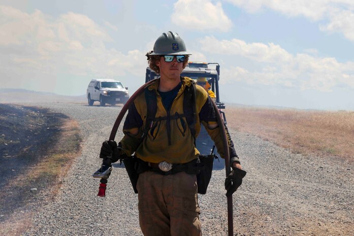 Crew members of the Air Force Civil Engineer Center Wildland Fire Support Module conduct a prescribed fire, also known as a controlled burn, on June 6th, 2022 at Beale Air Force Base, Calif.