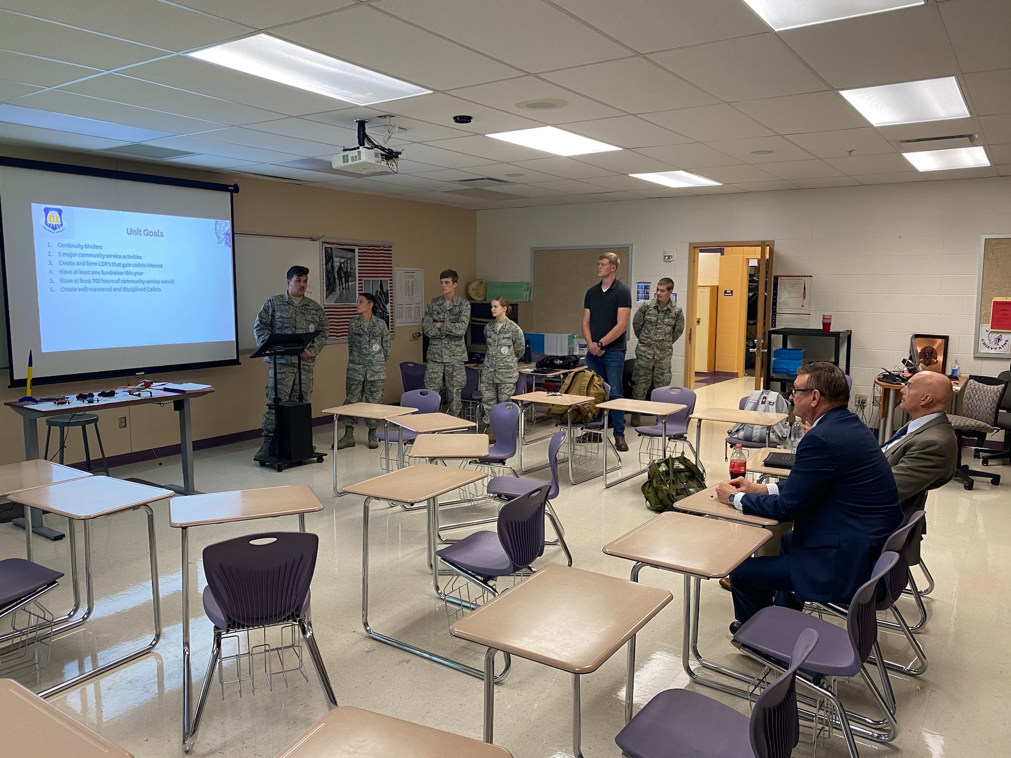 Air Force Junior ROTC Cadet Xavier Hancock, left, gives a briefing to personnel from Air Force Junior ROTC Headquarters at Logan High School, Logan, Ohio, Aug. 29, 2022.  Logan High School received approval to start an Air Force Junior ROTC program last year, and the program started its first full academic year in August of 2022.