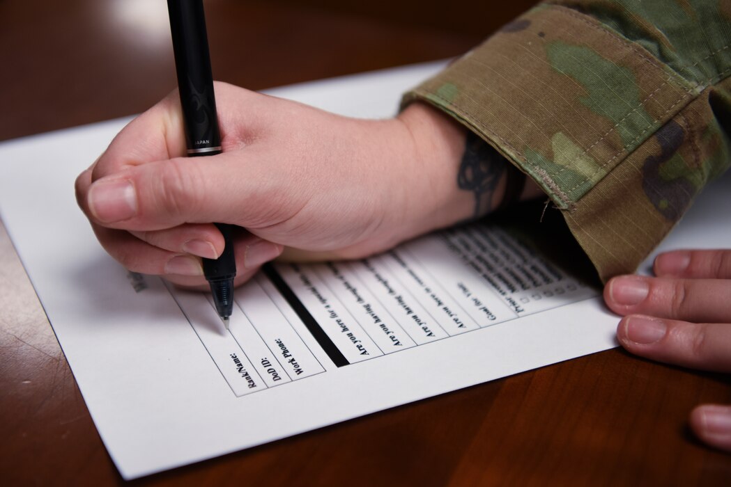 U.S. Air Force Staff Sgt. Samantha Gilbert, 17th Operational Medical Readiness Squadron’s mental health flight chief, fills out a patient triage form at the Ross Clinic mental health building, Goodfellow Air Force Base, Texas, August 22, 2022. The triage forms are a tool used in the new targeted care program, which streamlines the assessment process and improves accessibility to mental health care for members of the Goodfellow community. (U.S. Air Force photo by Senior Airman Michael Bowman)