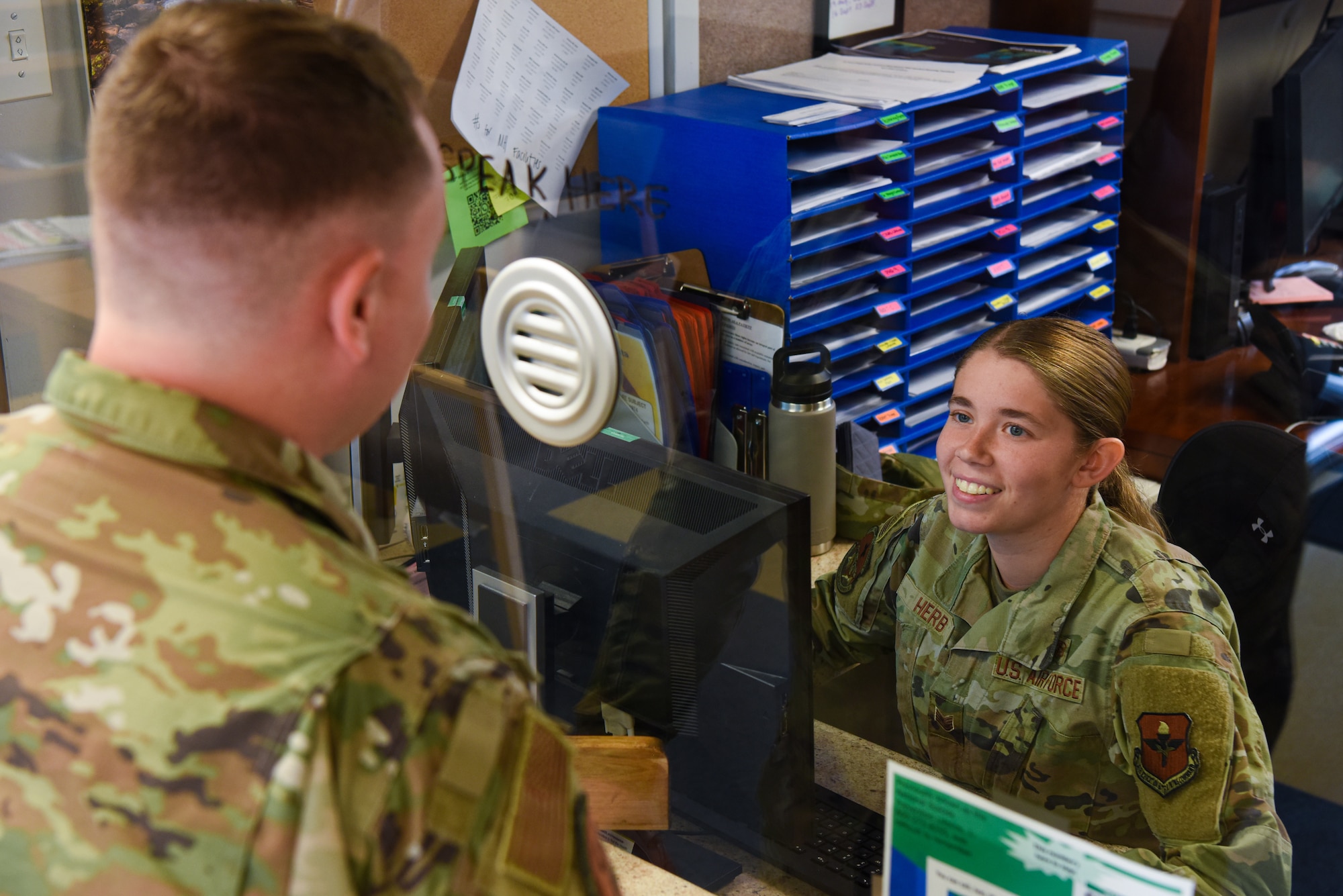 U.S. Air Force Staff Sgt. Jade Herb, 17th Operational Medical Readiness Squadron mental health technician, checks-in a patient in at the Ross Clinic mental health flight building, Goodfellow Air Force Base, Texas, August 22, 2022. Mental health technicians are first-line medical paraprofessionals who meet new patients during an initial mental health appointment. (U.S. Air Force photo by Senior Airman Michael Bowman)