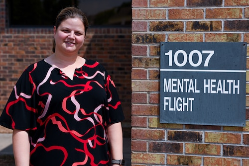 Dr. Michelle Hanby, clinical psychologist, 17th Medical Group mental health element director, and acting mental health flight commander, poses for a photo outside of the Ross Clinic mental health flight building, Goodfellow Air Force Base, Texas, August 22, 2022.  Hanby graduated from the University of Maine with a Ph.D. in clinical psychology. (U.S. Air Force Photo by Senior Airman Michael Bowman)