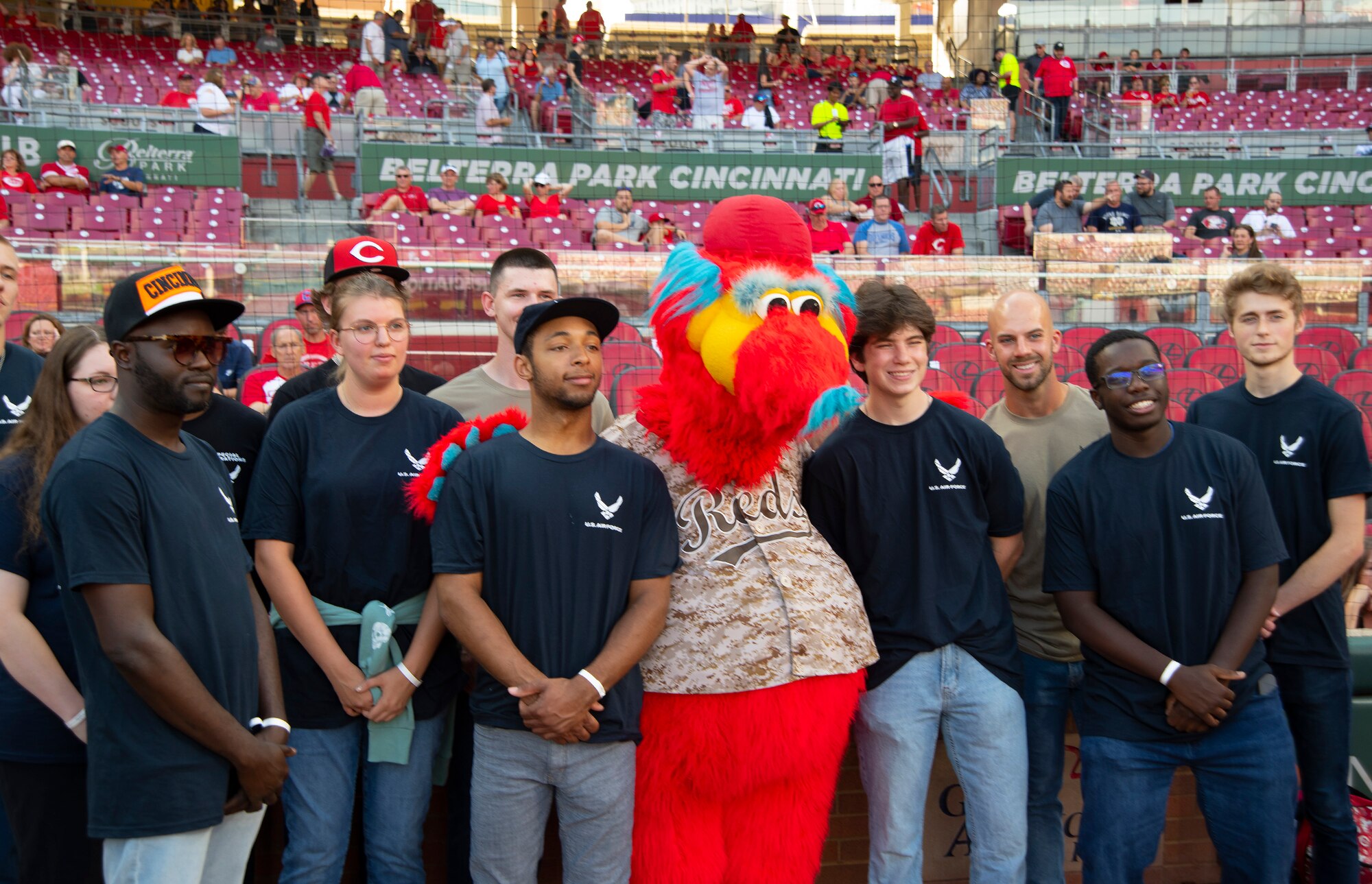 A group of Air Force recruits pose with Cincinnati Reds mascot Gapper prior to the Reds-Rockies game Sept. 2, 2022. As part of Military Appreciation Night pregame activities, the recruits took the oath of enlistment on the field at Great American Ball Park. (U.S. Air Force photo by R.J. Oriez)
