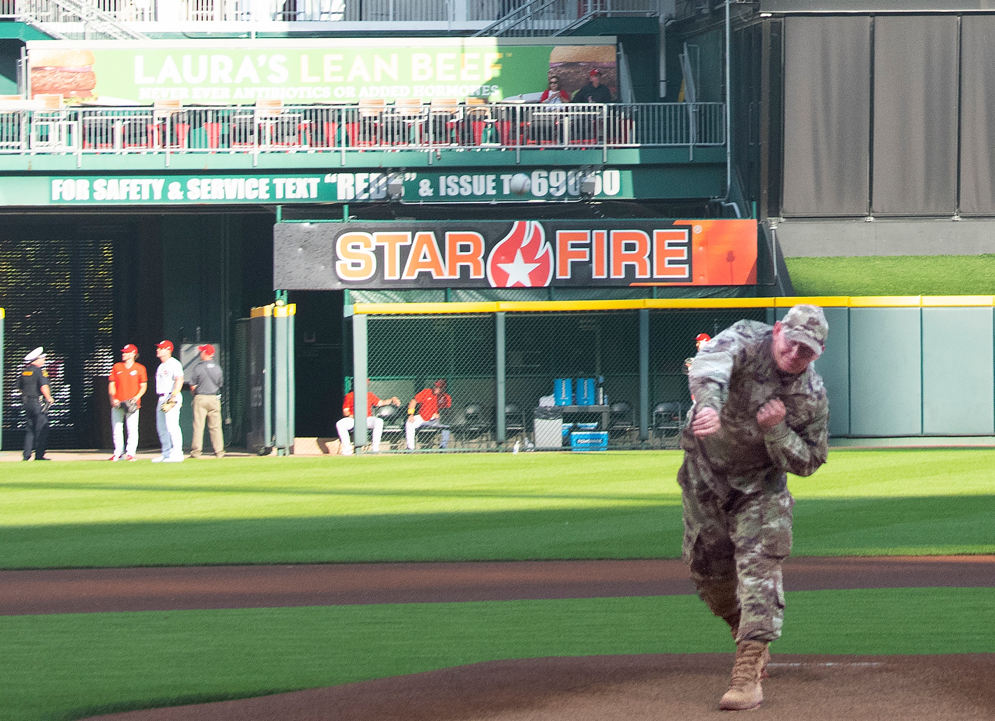 Col. Christopher Meeker, 88th Air Base Wing and Wright-Patterson Air Force Base commander, throws the ceremonial first pitch before the Reds vs. Rockies game Sept. 2, 2022, at Great American Ball Park in Cincinnati. Meeker was invited to throw out the pitch as part of the Reds’ annual Military Appreciation Night. (U.S. Air Force photo by R.J. Oriez)