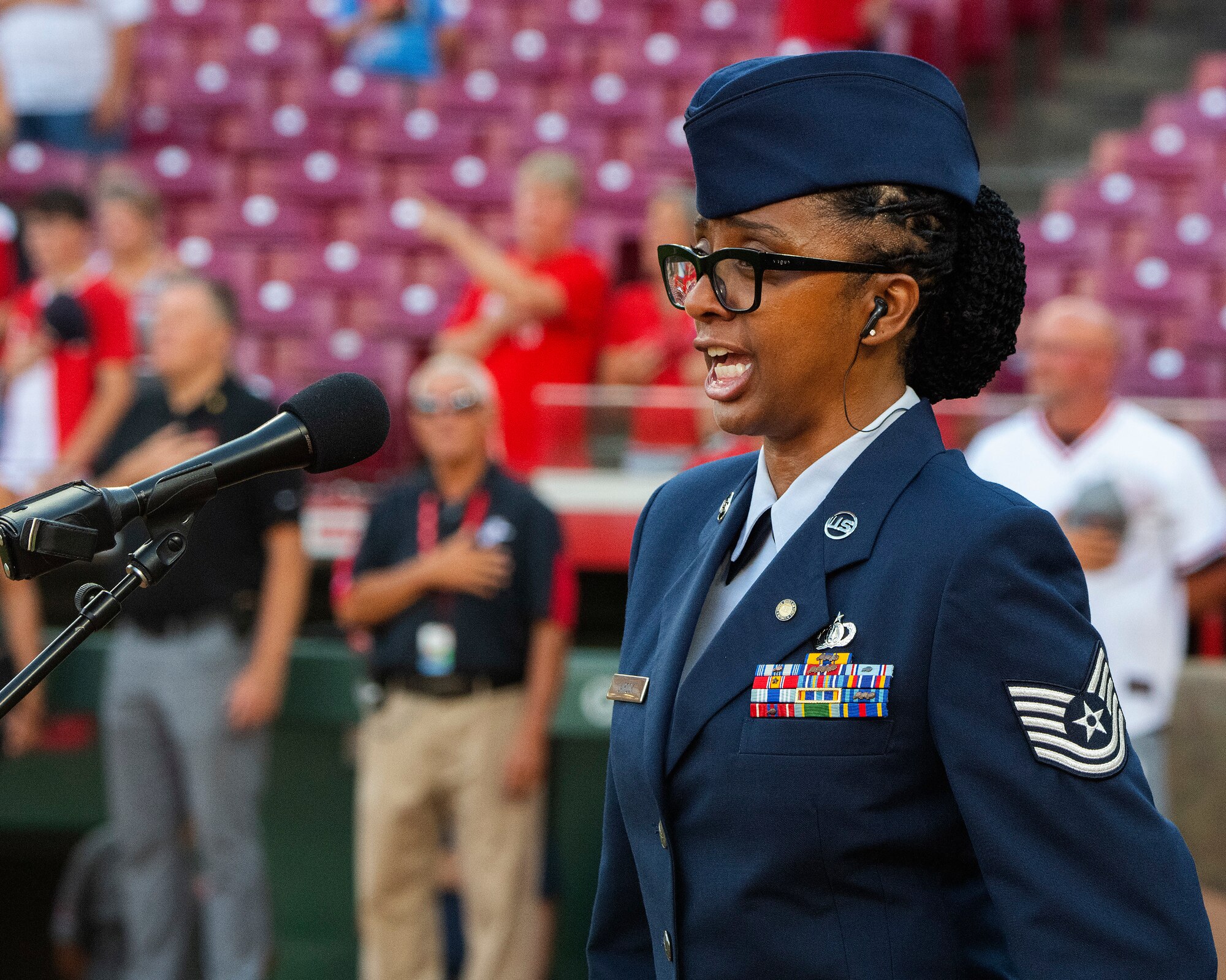 Retired Tech. Sgt. Felita LaRock sings the national anthem at the start of the Cincinnati Reds game against the Colorado Rockies at Great American Ball Park in Cincinnati. LaRock was invited to sing the anthem as part of the Reds’ annual Military Appreciation Night. (U.S. Air Force photo by R.J. Oriez)