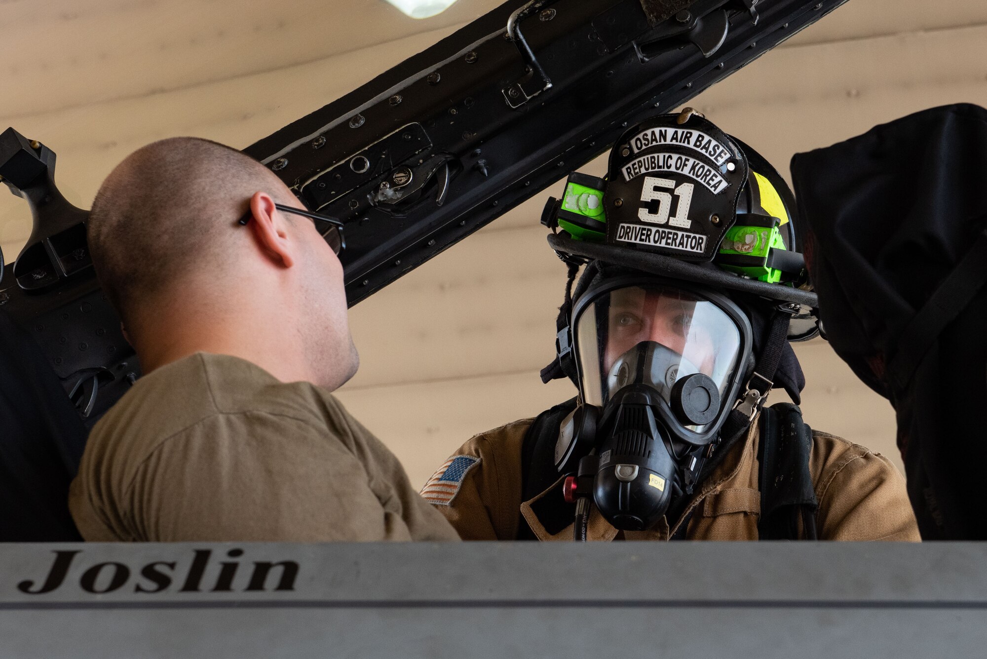 Tech. Sgt. Angel Flores, 36th Fighter Generation Squadron propulsion section chief, listens to Senior Airman Jacob Jenkins, 51st Civil Engineer Squadron firefighter, during a hydrazine response training at Osan Air Base, Republic of Korea, Aug. 26, 2022.