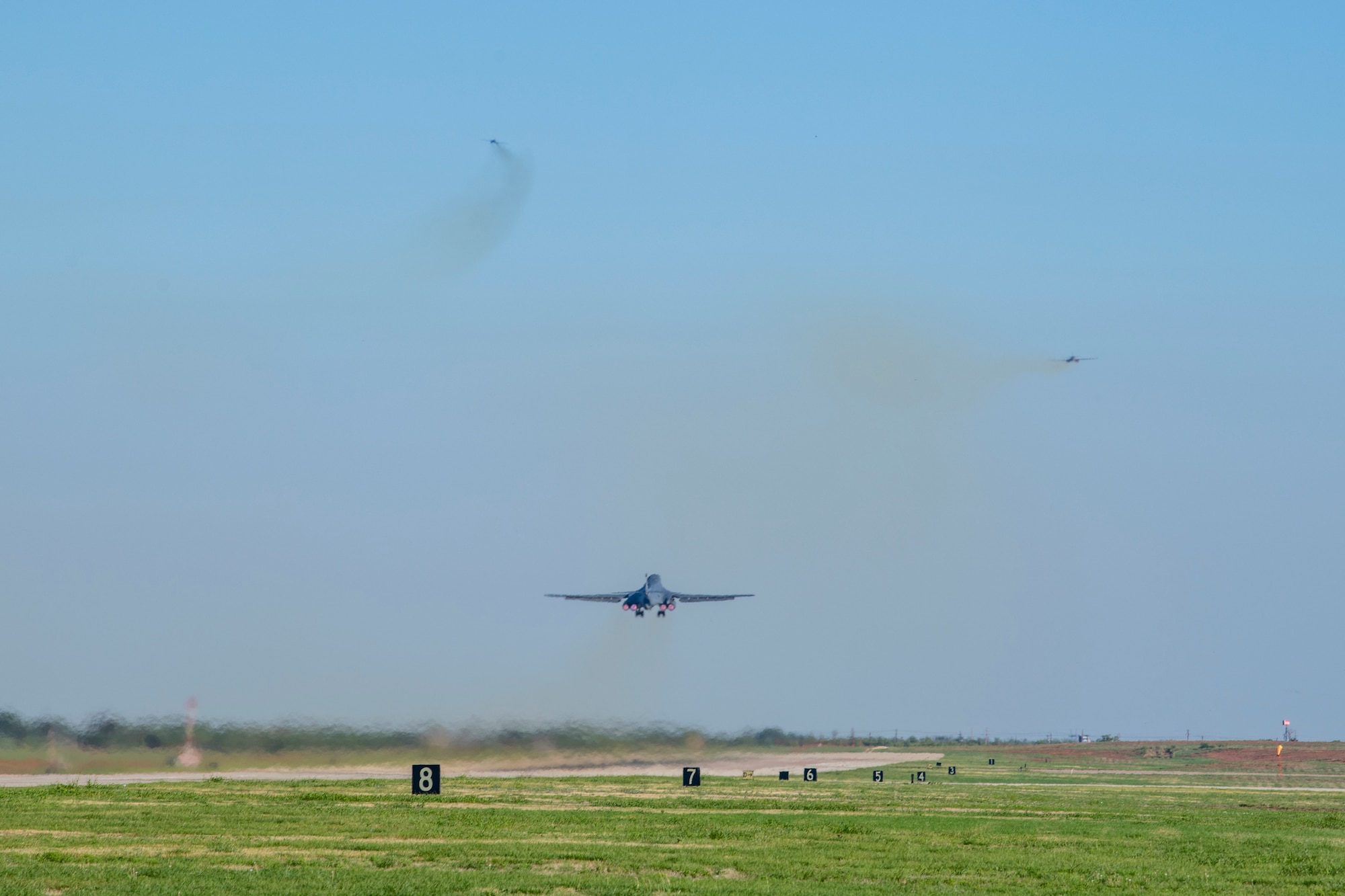 Three B-1B Lancers takeoff from Dyess Air Force Base, Texas Sept. 7th, 2022 for a Bomber Task Force mission to U.S. Southern Command. BTF missions familiarize aircrews with air bases and operations in different Geographic Combatant Commands and enable them to maintain a high state of readiness and proficiency, validating the U.S. Air Force Global Strike Command’s always-ready global strike capability. (U.S. Air Force photo by Senior Airman Mercedes Porter)