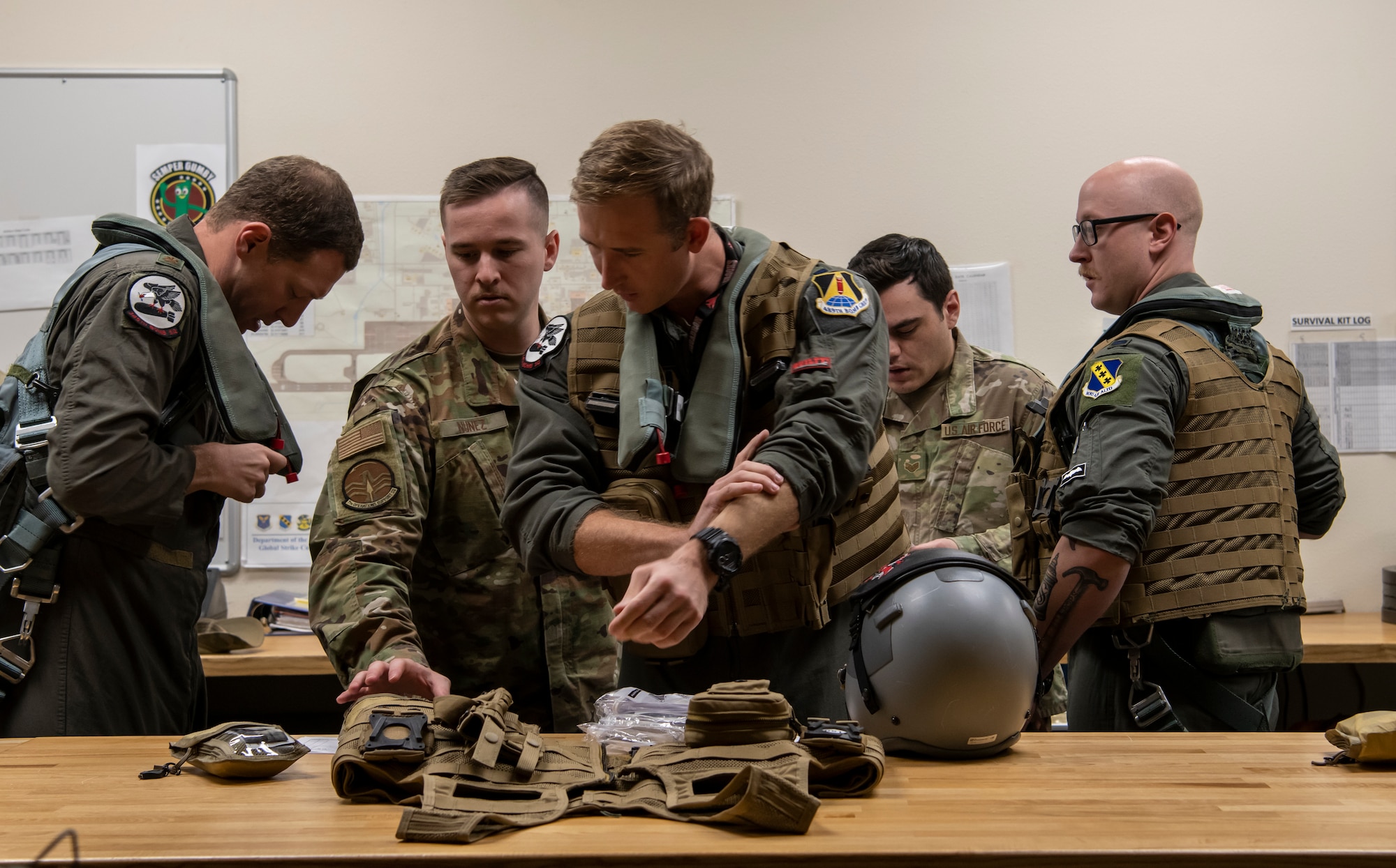 U.S. Air Force pilots and weapons system officers, assigned to the 307th and 7th Bomb Wings, gear up before flight at Dyess Air Force Base, Texas Sept. 7th, 2022. During their mission, crews conducted counter illicit Chinese fishing operations off the coast of Guatemala. (U.S. Air Force photo by Senior Airman Mercedes Porter)
