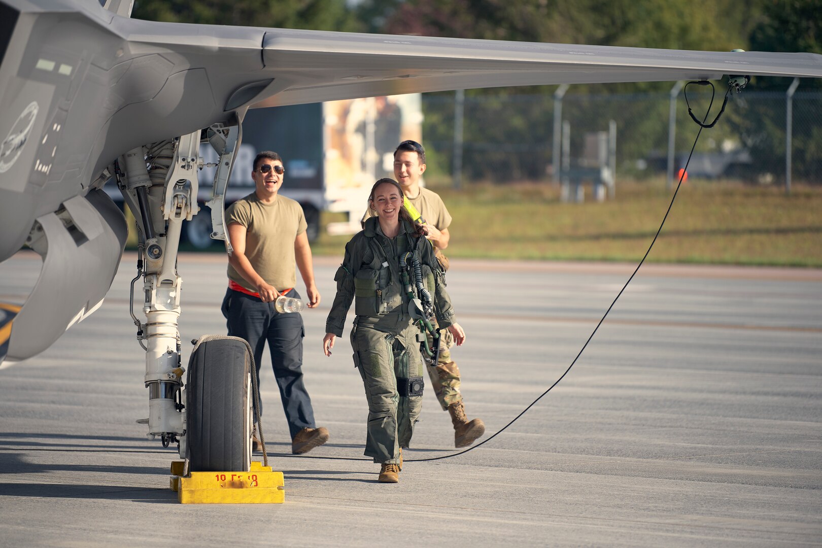 A photo of 1st Lt. Kelsey Flannery, an F-35A Lightning II pilot assigned to the 134th Fighter Squadron of the Vermont Air National Guard's 158th Fighter Wing, inspects her jet before taking off for a training mission from South Burlington Air National Guard Base, Vermont, Sept. 7, 2022. Flannery, who is the Air National Guard's first female F-35 pilot, made her first flight with the 158th after returning from three years of flight training. (U.S. Air National Guard photo by Master Sgt. Ryan Campbell)