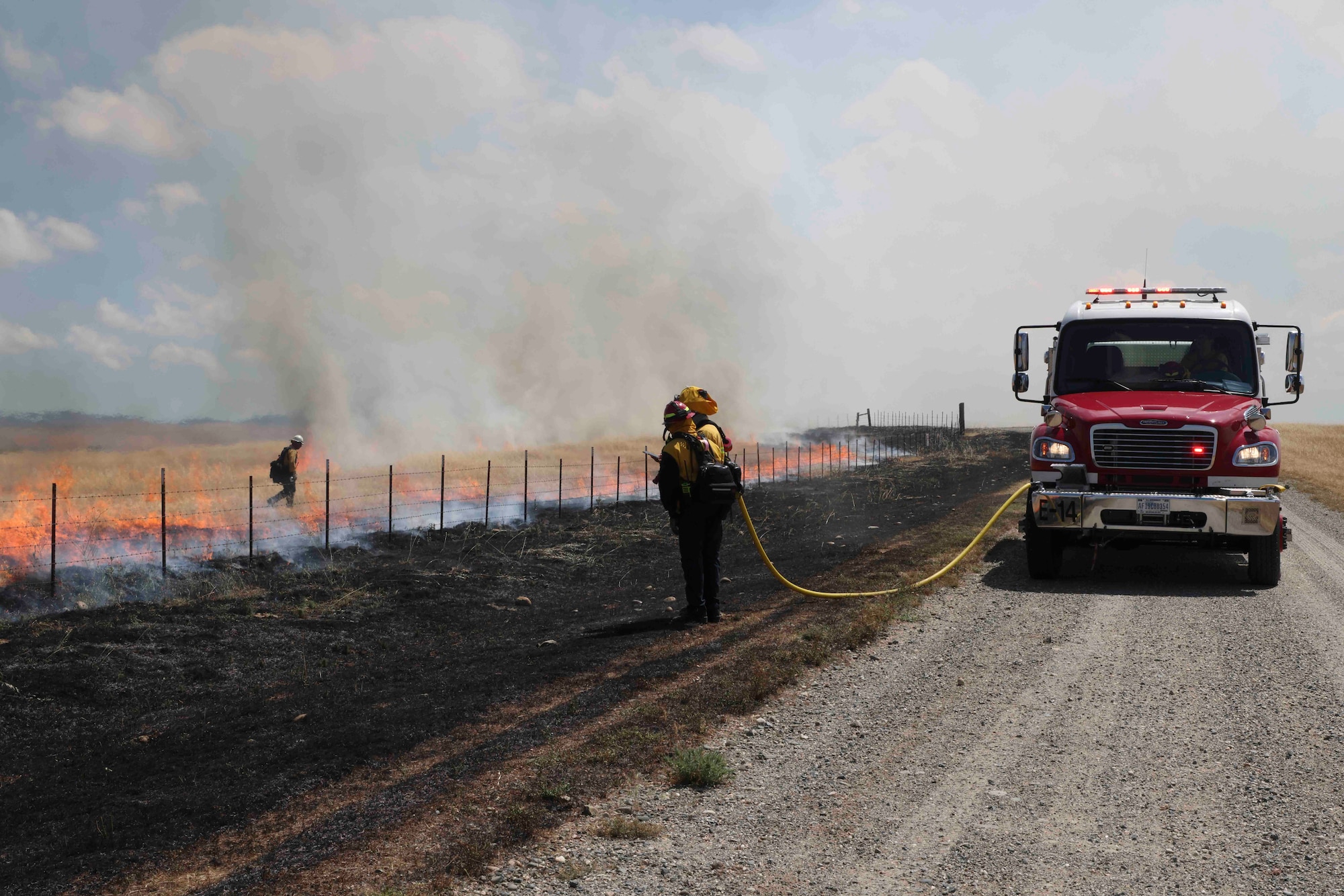 Crew members of the Air Force Civil Engineer Center Wildland Fire Support Module conduct a prescribed fire, also known as a controlled burn, on June 6th, 2022 at Beale Air Force Base, Calif.