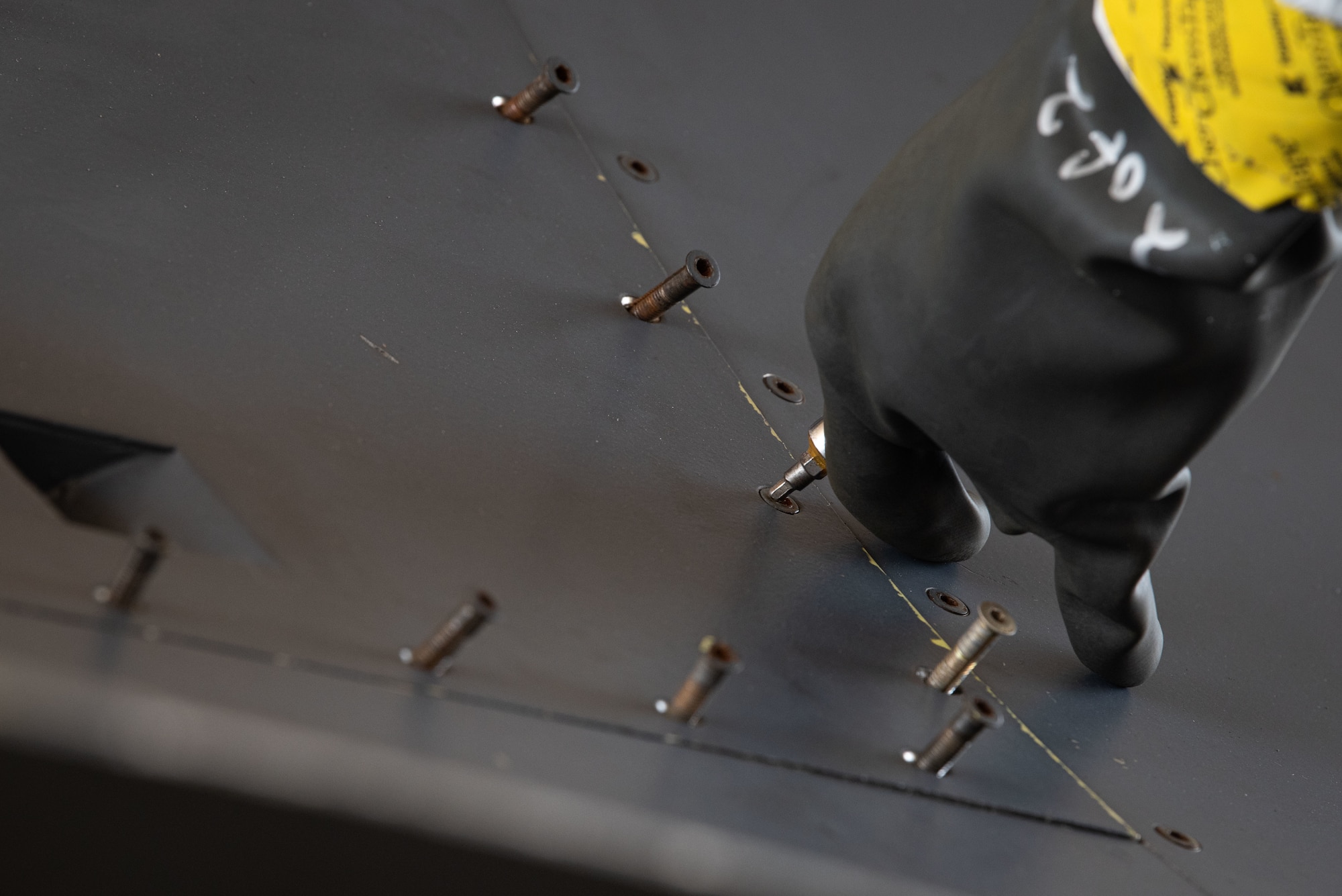 Senior Airman Christian Byrd, 51st Maintenance Squadron aircraft fuel systems journeyman, removes screws from an F-16 Fighting Falcon panel during a hydrazine response training at Osan Air Base, Republic of Korea, Aug. 26, 2022.