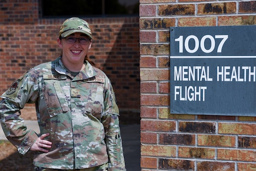 U.S. Air Force Staff Sgt. Samantha Gilbert, 17th Operational Medical Readiness Squadron’s mental health flight chief, poses for a photo outside of the 17th Medical Group Ross Clinic mental health flight building, Goodfellow Air Force Base, Texas, August 22, 2022. Gilbert is leading the efforts in providing targeted mental health care to members of the Goodfellow community.  (U.S. Air Force photo by Senior Airman Michael Bowman)