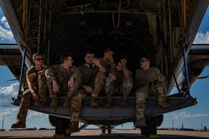 A group of Dyess Air Force Base Airmen await the load of a C-130J Super Hercules at Naval Air Station Fort Worth, Texas, Aug. 28, 2022. During exercise Patriot Fury, the 317th Airlift Wing integrated with the 301st Fighter Wing, special forces and the 621st Crisis Response Team, Joint Base McGuire-Dix-Lakehurst, New Jersey. (U.S. Air Force photo by Airman 1st Class Ryan Hayman)