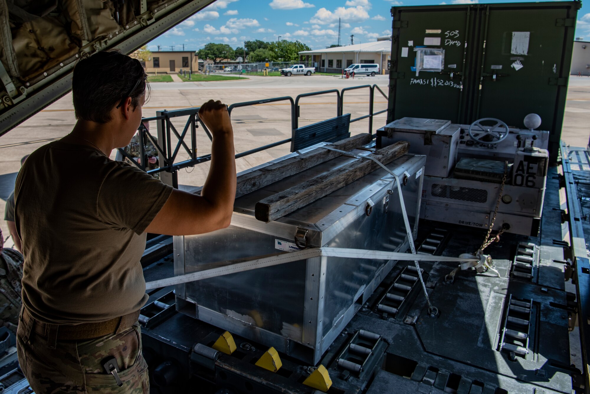 Tech. Sgt. Dani Galich, 40th Airlift Squadron tactics flight chief, loads the back of a C-130J Super Hercules during exercise Patriot Fury at Naval Air Station Fort Worth, Texas, Aug. 28, 2022. During Patriot Fury, aircrews trained by performing halo jumps, fighter integration and difficult landing situations. (U.S. Air Force photo by Airman 1st Class Ryan Hayman)