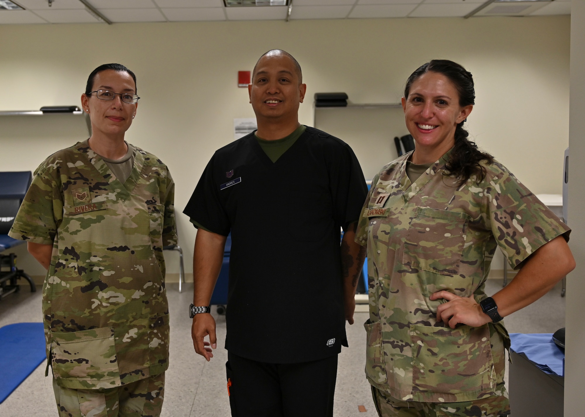 U.S. Air Force Staff Sgt. Monica Rivera, 36th Medical Group Physical Therapy Clinic noncommissioned officer in charge, Tech. Sgt. Joel Andres, 36 MDG PT Clinic human performance flight chief and Capt. Meredith LaKomski, 36 MDG PT Clinic element chief, pose for a group photo on Andersen Air Force Base, Guam, Sept. 7, 2022. The PT Clinic is responsible for treating acute or chronic musculoskeletal pain, impact injuries, joint and muscle pain, post-operative conditions and sports injuries. (U.S. Air Force photo by Airman 1st Class Lauren Clevenger)