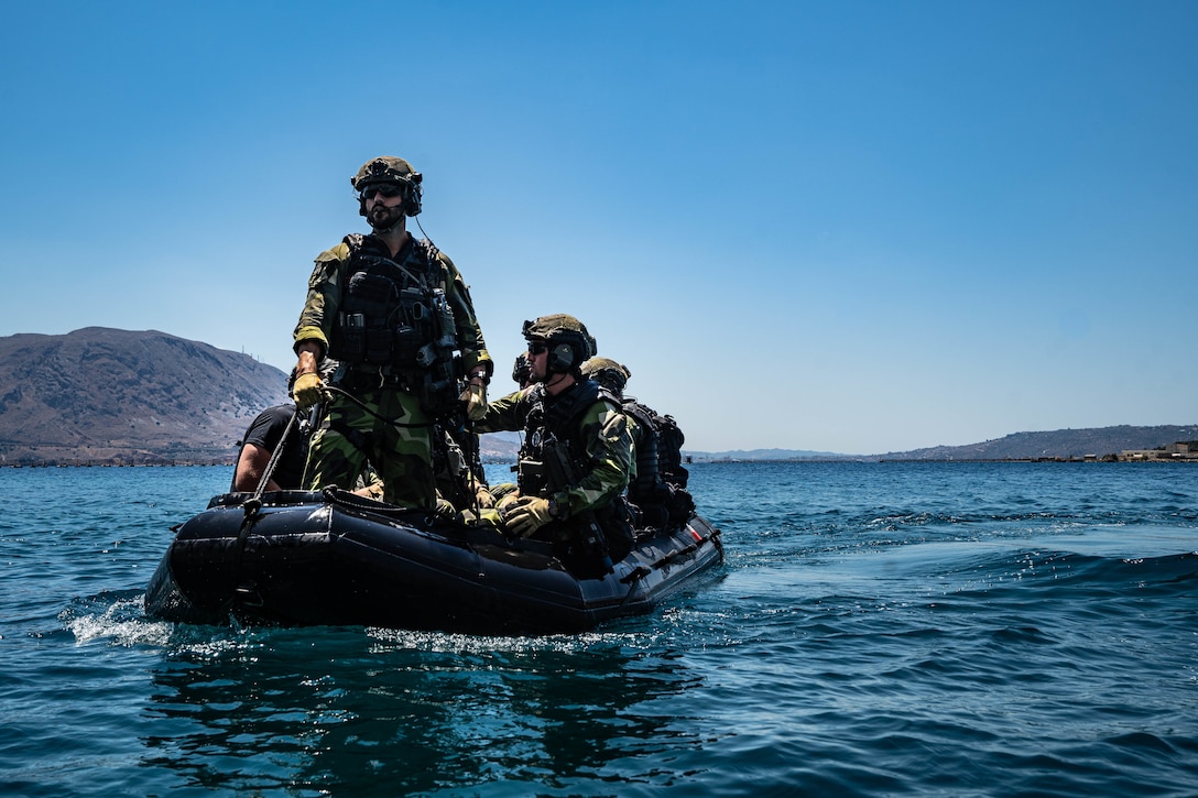 Swedish Marines with 4th Marine Regiment, Swedish Amphibious Corps ride a F470 combat rubber raiding craft during exercise TYR 22 at the NATO Maritime Interdiction Operational Training Centre (NMIOTC) in Souda bay, Greece, July 13, 2022. TYR 22 is a maritime interdiction operations exercise held at NMIOTC, bringing together Swedish Marines, U.S. Marines, U.S. Navy Special warfare combatant-craft crewmen to improve US and NATO Partner operational capacity, capability, and interoperability. (U.S. Marine Corps photo by Sgt. William Chockey)
