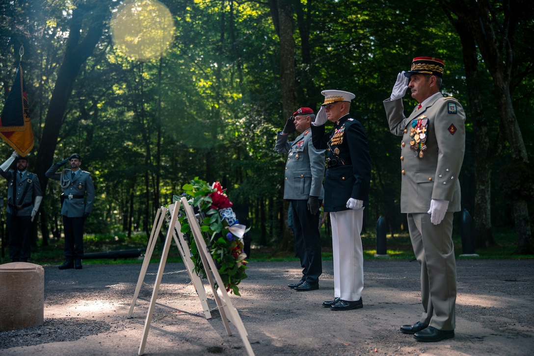 The Commandant of Marine Corps, General David H. Berger, salutes at a private ceremony at Aisne-Marne American Cemetery marking the 104th anniversary of the Battle of Belleau Wood, May 29, 2022. The Battle of Belleau Wood is remembered for the intensity of the fighting and sustained, as well as for the participation of the 5th and 6th Marine Regiments. To this day, Marines assigned to these two regiments wear the French fourragere on the left shoulder of their uniforms as a reminder of their unit's distinguished service during the First World War. (U.S. Marine Corps photo by Staff Sgt. Akeel Austin)