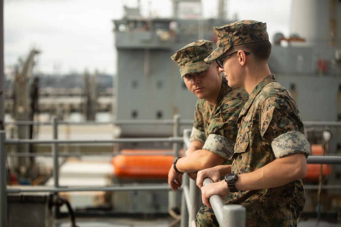 U.S. Marine Corps Cpl. Devin T. Fairman, right, a Marine Air-Ground Task Force planning specialist with Fleet Marine Force, Atlantic, Marine Forces Command, Marine Forces Northern Command, and Pfc. Sean Juy, left, a data systems administrator with Hampton Roads Detachment, 2nd Network Battalion, Cyberspace Command, converse while aboard the USS Carter Hall (LSD 50), moored at Naval Station Norfolk, Virginia, Sept. 6, 2022. Maryland Fleet Week & Flyover Baltimore is an annual public event that celebrates the contributions of the U.S. sea services and maritime capabilities from the U.S. Marine Corps, U.S. Navy and U.S. Coast Guard. Over 2,300 service members participated in Maryland Fleet Week & Flyover Baltimore 2022 engaging and assisting with ship tours, live bands and static equipment displays. (U.S. Marine Corps photo by Lance Cpl. Angel Alvarado)