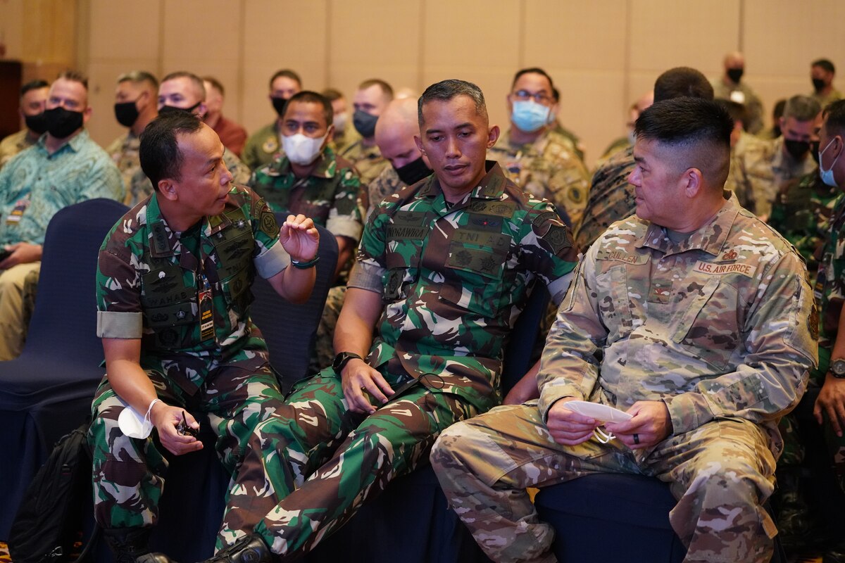 Air Force Col. Christopher Cullen, right, Hawaii Air National Guard logistics officer, discusses the schedule for the first day of Exercise Gema Bhakti 2022, Sept. 9, 2022, Jakarta, Indonesia. Gema Bhakti 22 is a USINDOPACOM Joint Exercise Program  to increase interoperability and enhance regional stability and security through bilateral and multilateral partnerships.