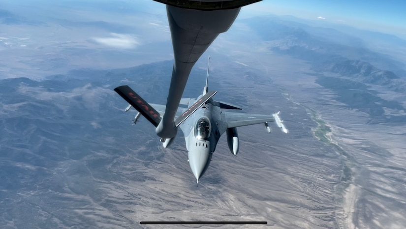 An  F-16 Falcons refuels from a KC-135R Stratotanker from the 151st Air Refueling Wing Aug. 17, 2022 above Utah's west desert.