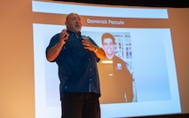 William Jimeno speaks on a stage